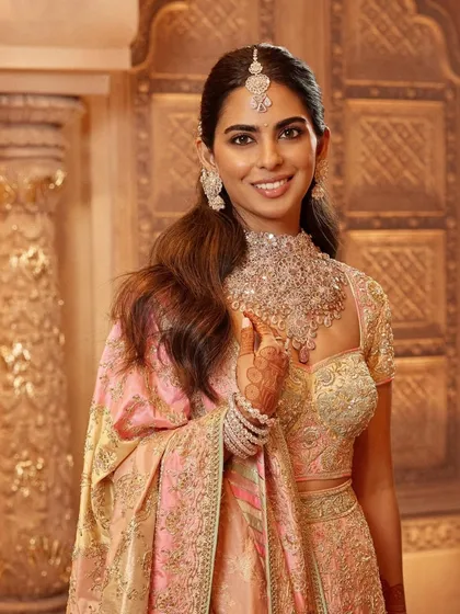 A detailed shot of the Abu Jani Sandeep Khosla ensemble, focusing on the brilliant diamond necklace and matching earrings. Accessorizing is key to elevating any couture look.