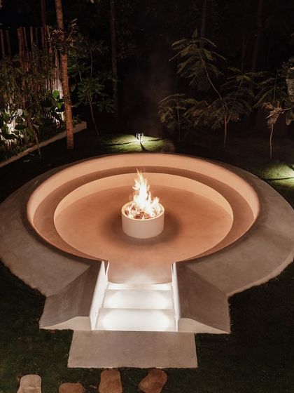 I designed this sunken fire pit as a gathering spot for cool evenings. The circular, tiered design creates an intimate setting, with built-in lighting to cast a warm glow on the surrounding lawn.