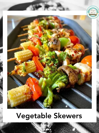 My colorful grilled vegetable skewers are a healthy and delicious option. A mix of zucchini, bell peppers, baby corn, and broccoli are grilled and served on a sizzler plate.