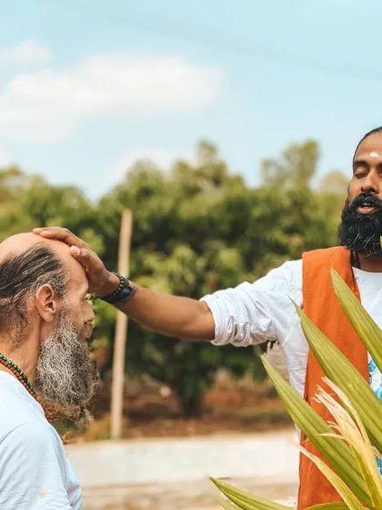 A simple touch can be a powerful teaching tool. Here, I offer a blessing and energetic alignment to a student, a practice of Shaktipat that is part of the deeper spiritual transmission at our ashram.