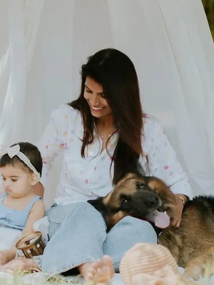 A happy moment with the whole family, fur baby included. The love in this photo is overflowing.