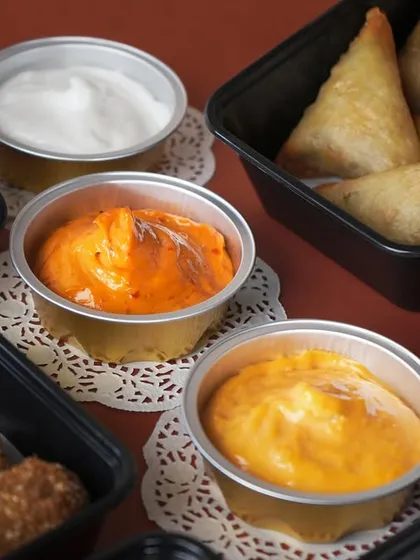 A selection of my signature dips, including Garlic Mayo, Cheesy Jalapeño, and Chipotle, perfect for pairing with the various starters in the Iftar box.