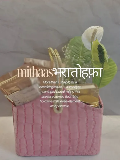 A "Mithaas Bhara Tohfa" is a heartfelt gesture, a small bundle of joy that speaks volumes. This chic, pink croc-finish basket is filled with warmth and care, perfect for those moments when you want to send a little love.