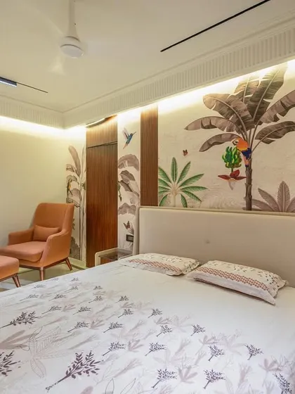 We brought the outdoors in with this nature-inspired bedroom design. A beautiful tropical-themed wallpaper serves as a stunning feature wall, complemented by an earthy color palette and organic textures in the furniture and lighting.