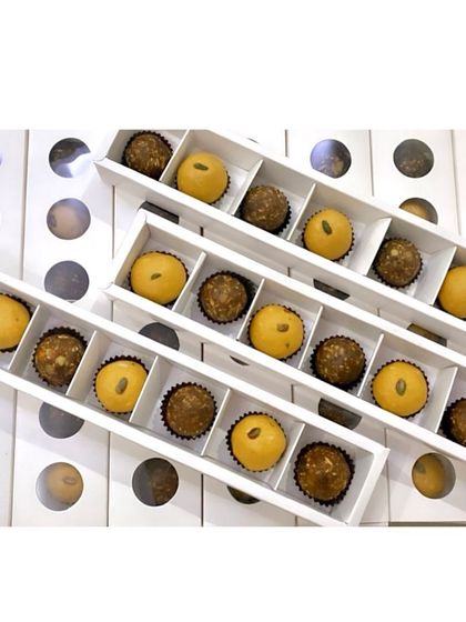 An assortment of our Besan and Date Walnut laddoos packed in long gift boxes. This is a popular choice for corporate orders and festive gifting.