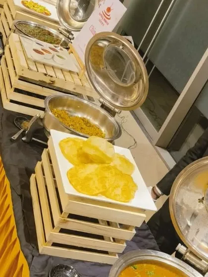 A buffet setup featuring Choley Bhaturey for a corporate housewarming party. We can provide full North Indian meal spreads, including breads, curries, and rice.