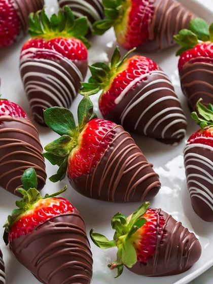 Fresh strawberries dipped in rich milk chocolate and drizzled with white chocolate. This is a classic and elegant gift for Valentine's Day.
