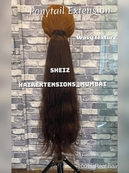 This is our wavy texture ponytail extension, made from 100% real hair. It is designed to blend seamlessly while providing significant length and a natural wave. We offer customization for all our hair products.