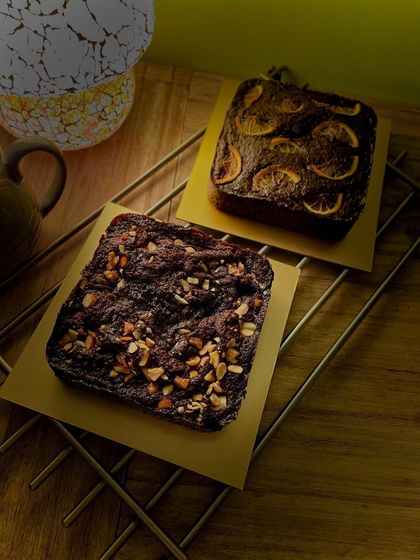 A double chocolate day in my kitchen. On the left, a vegan chocolate nuts cake, and on the right, a whole wheat orange chocolate cake. Both are equally delicious.