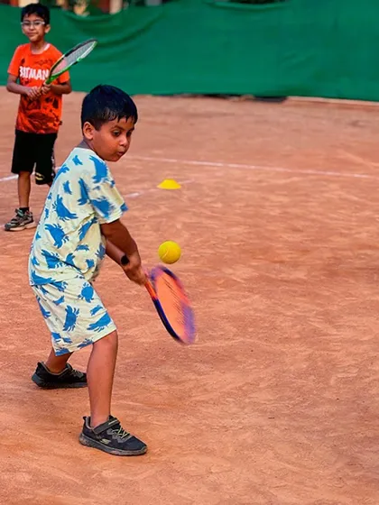 This player is practicing his forehand, showing good preparation and balance before the shot. We work on footwork alongside stroke production.
