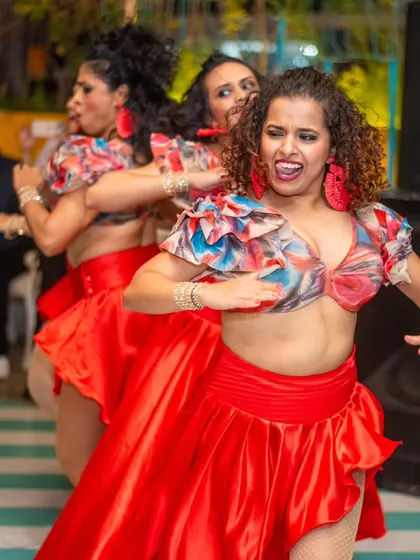 The fierce expressions and sharp movements say it all. This action shot from a live performance captures the passion and intensity my ladies' team brings to the stage.