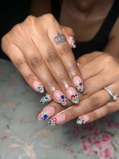 For those who believe more is more, this one is for you. I carefully placed a cascade of multi-colored rhinestones over a soft pink base for the ultimate bling. It’s a full-on glamorous look that is designed to dazzle.