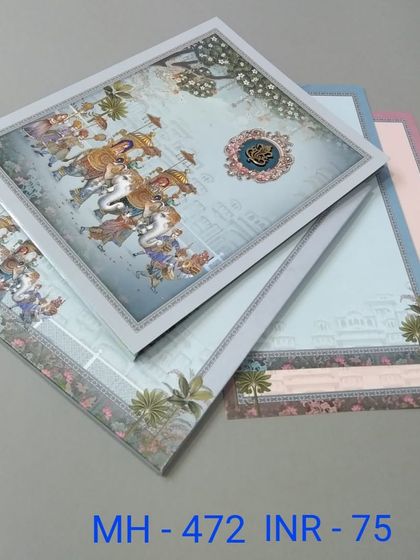 This card features a vibrant illustration of a wedding procession, or 'baraat', with elephants and horses. The set includes multiple inserts in coordinating pastel colors.