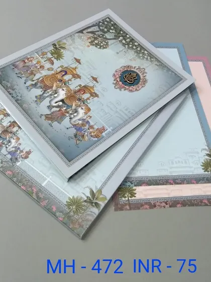 This card features a vibrant illustration of a wedding procession, or 'baraat', with elephants and horses. The set includes multiple inserts in coordinating pastel colors.