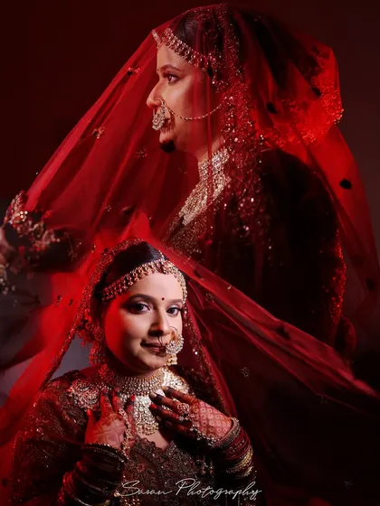A creative double-exposure bridal portrait with dramatic red lighting, capturing a sense of mystery and elegance.