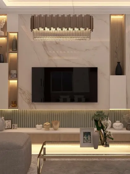 This living area exemplifies modern luxury with its integrated TV unit featuring a marble-finish accent wall and custom backlighting. The design balances sophisticated aesthetics with practical storage, creating a focal point that is both elegant and functional for a contemporary Bangalore home.