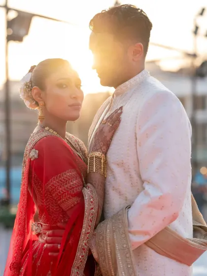 An artistic couple portrait using the sun flare to create a warm, ethereal glow. This shot feels both intimate and epic at the same time.