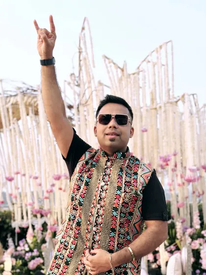 Rocking a semi-traditional look in front of a beautiful floral wedding mandap. This embroidered jacket is perfect for a modern yet ethnic celebration.