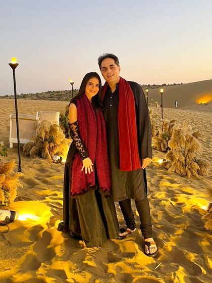 A quiet moment with my husband during a destination wedding. These events are not just about the big performances but also about the shared, intimate moments.