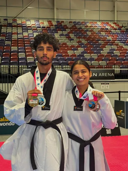Our champions Mohit and Sonia posing with their medals after a successful tournament in Australia.