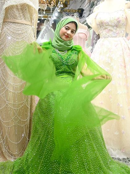 The beautiful Ayesha Saju looking radiant in the green Swarovski gown. It's a perfect blend of modern glamour and timeless modesty.