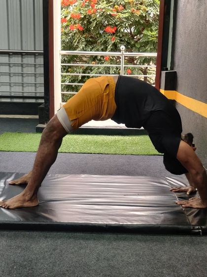 Flexibility matters for everyone. An adult student works on his bridge pose to improve spinal mobility.