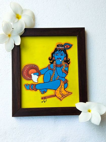 This painting shows Navanita Krishna, the butter dancer, in a joyful pose. The 9x10 inch framed piece is styled with fresh flowers to highlight its simple beauty and charm.