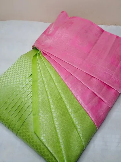 A unique combination of lime green and pink on this silk saree.