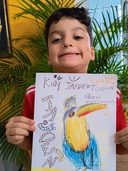 Another proud pose from Jayden with his "King Jayden Toucan" masterpiece.