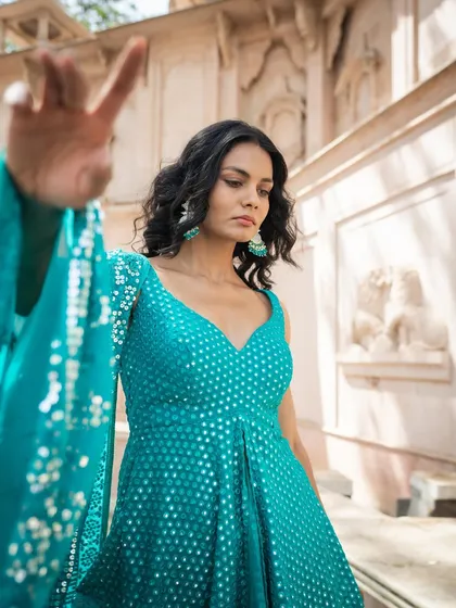 Don't stress about what to wear to the next wedding. Rent a fun fashion piece like this green sharara and enjoy the party.