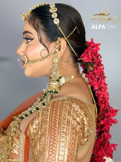 A side profile showcasing the detailed hairstyle, the heavy earrings, and the flawless makeup contour.