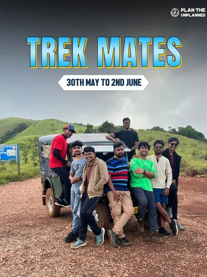A group of friends posing with a jeep on a mountain road. The journey to the trail is an adventure in itself, filled with fun and scenic drives.