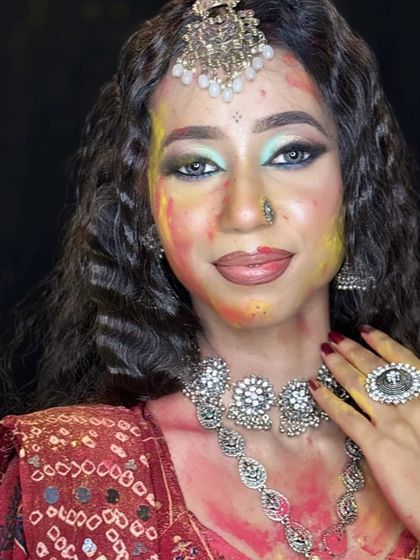 A full-face portrait of the Holi makeup, showing the beautiful contrast between the glam and the colors.