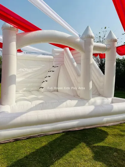 Our All-White Dream Castle set up under a festive red and white tent, showing how it fits into a carnival or circus-themed party.