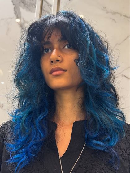 A final look at the stunning blue hair transformation, a perfect example of a bold and beautiful fashion color.