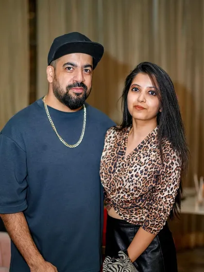 Posing with a guest at the party.