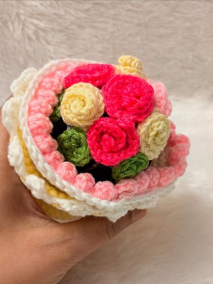 A detailed shot of the bouquet inside the pink-trimmed reversible doll. I use bright pinks and yellows to make the flowers pop, ensuring it's beautiful from every angle.