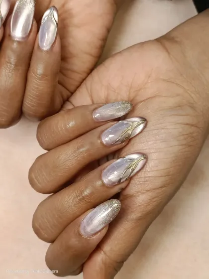 A detailed shot of my cat-eye, glitter, and chrome combination. You can see how the different textures work together to create a luxurious and eye-catching manicure.