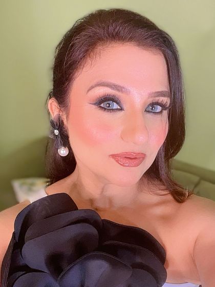 A close-up of another one of my birthday looks, featuring a dramatic eye and statement earrings.