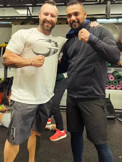 Look up higher. Posing with international coach Kris Gethin at his gym. It's important to learn from the best.