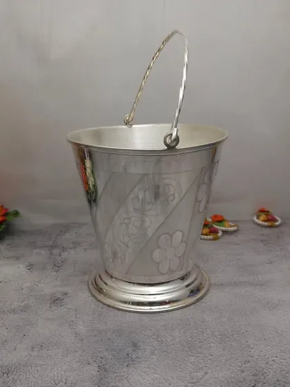 This German silver bucket is a unique and useful item. It can be used for holding flowers, water, or other offerings during large poojas and ceremonies.