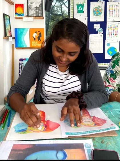 Working with oil pastels during a CFA class. Students get to explore the unique properties of each medium, from blending to layering.
