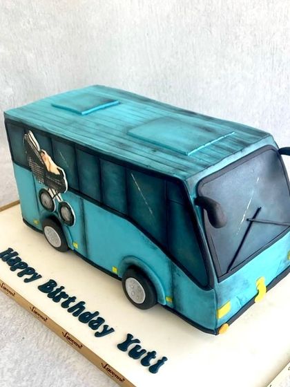 A simple but effective structural cake of a bus for Yuti's birthday. The details, like the baby in the stroller peeking out the window, make it extra special.