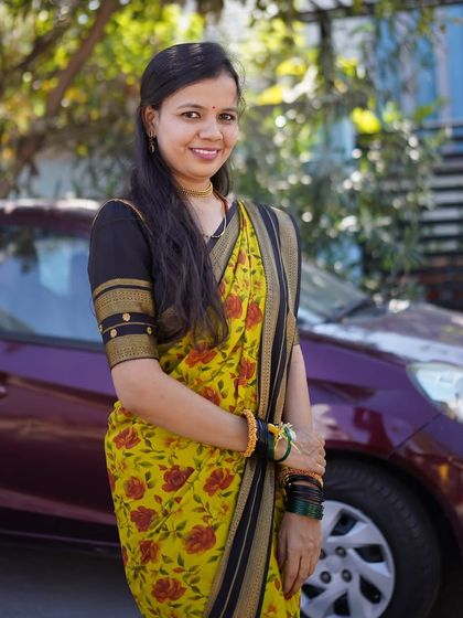 A beautiful portrait of my client Sudha mam in her yellow floral pure Mysore crepe digital print saree. Her smile says it all.