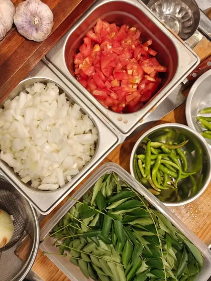 The fresh ingredients prepped for my culinary event in Japan. Onions, tomatoes, chillies, and curry leaves are the foundation of so many of my dishes.