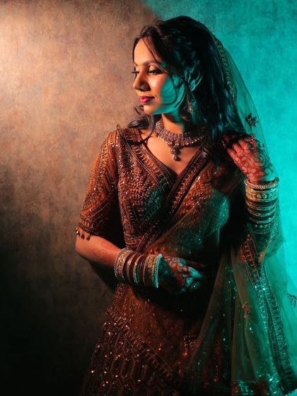 A creative and moody portrait from a ring ceremony, using dual-toned lighting for an artistic effect.