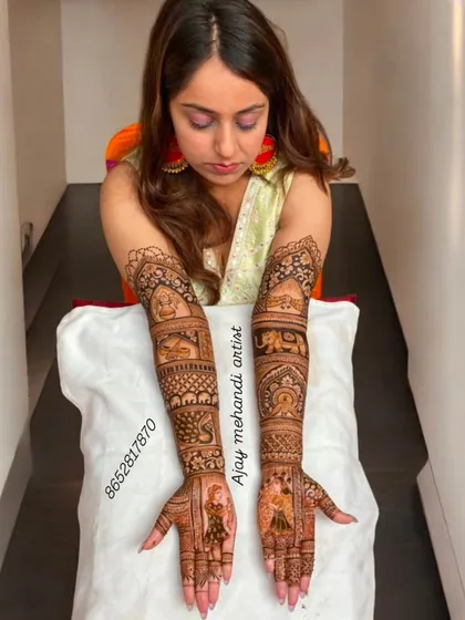 A lovely bridal design with portraits of the bride and groom on the palms. The arms are decorated with scenes from a wedding procession.