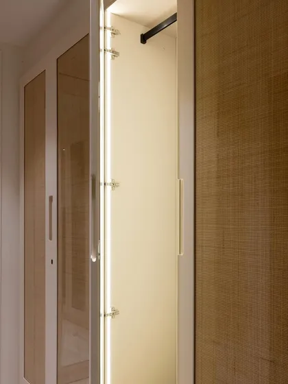Motion-sensor lights are a small detail that makes a big difference. The moment you open the wardrobe door, the interior lights up, making it easy to see everything without fumbling for a switch.