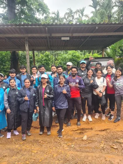Thumbs up from the group at a muddy trail start. A little dirt just adds to the adventure.