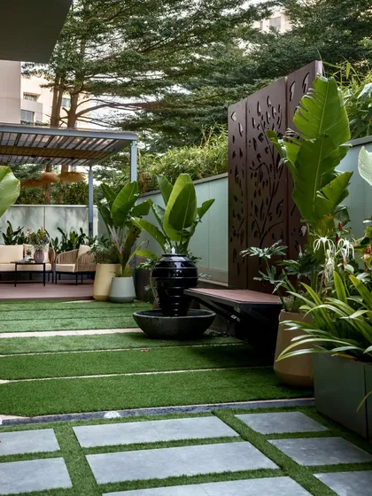 This urban retreat in Bangalore is one of our favorite transformations. We combined modern design with natural tranquility, incorporating a sleek pergola for shade, a soothing water feature, and lush tropical plants to create a private oasis. The space is perfect for quiet mornings and lively evenings, showing how a well-designed landscape becomes a true extension of your home.